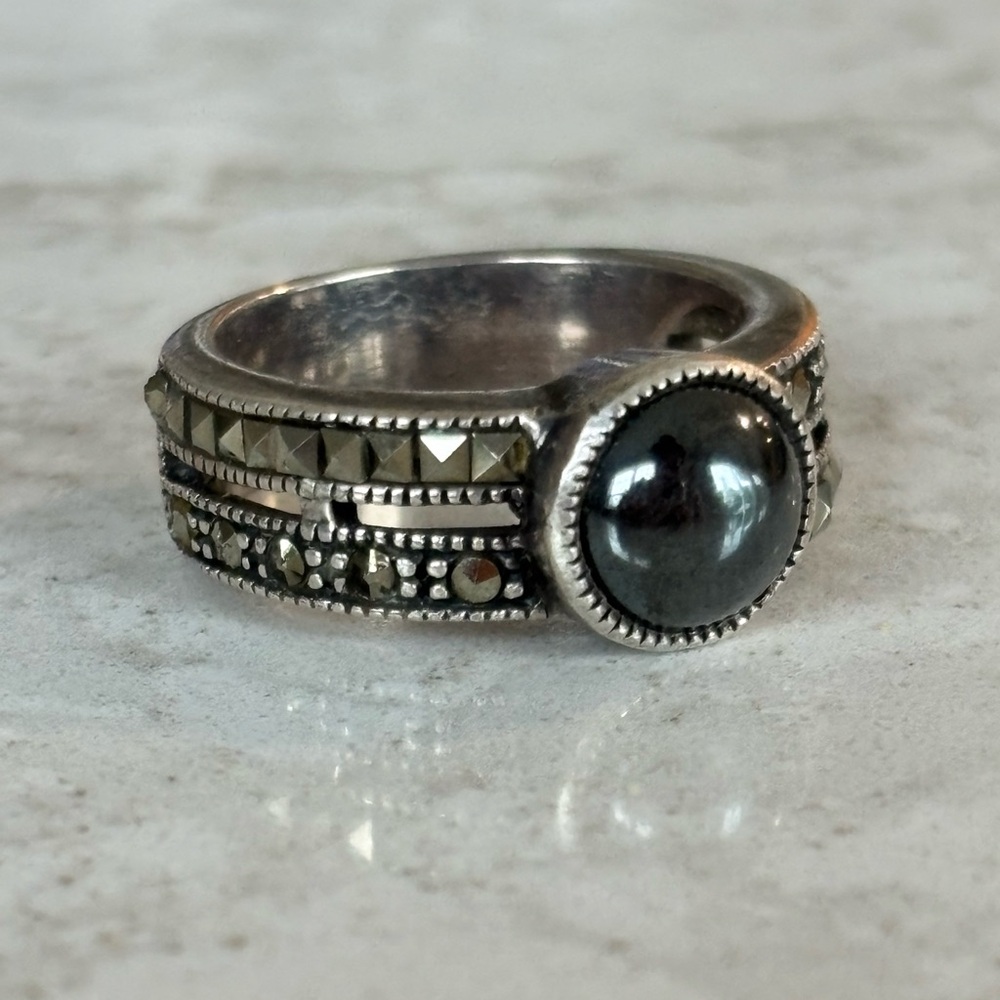 Intricate Silver and Black Gemstone Ring